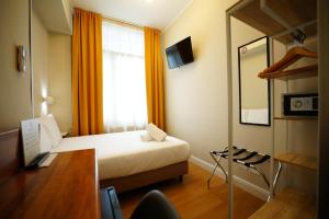 Postel nebo postele na pokoji v ubytování Hotel Montevecchio