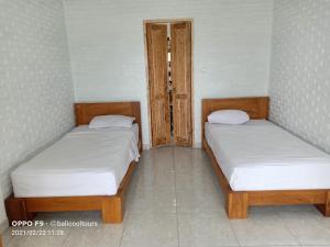 Cama o camas de una habitación en MAIMALU BEACH VIEW