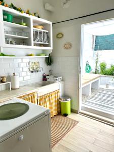 A kitchen or kitchenette at Cozy house with backyard at Iraklio Attikis