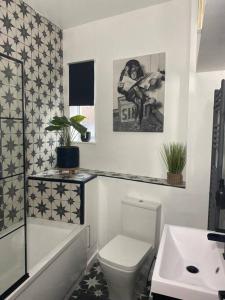 a bathroom with a toilet and a sink at Modern 1 bed town centre apartment in Tamworth in Tamworth