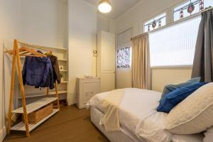 a small bedroom with a bed and a window at Historical Building dating back to 1900 in Nhill