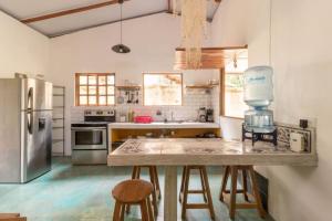 a large kitchen with a counter with a mixer on it at Casa Mazam in Talamanca