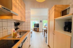 a kitchen with a sink and a counter top at Ferienhaus Anja 3 in Ueckeritz