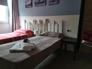 Postel nebo postele na pokoji v ubytování My Room Roma