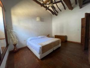 เตียงในห้องที่ Casa Real Amanvari