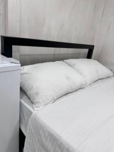 Postel nebo postele na pokoji v ubytování Mandarin Hotel
