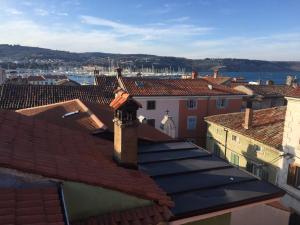 a view of roofs of buildings in a city at Apartmaji Sara, Izola - Isola in Izola