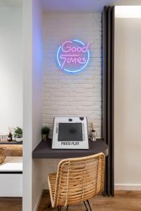 a sign that says good tunes on a wall at Good times - Luxury Studio Apartments in Xanthi