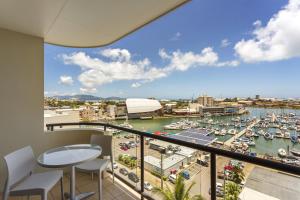 a balcony with a view of a marina at Aligned Corporate Residences Townsville in Townsville