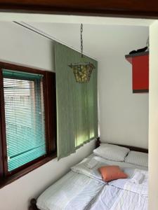 a bed in a room with a window at Hostel Scandic in Sarajevo