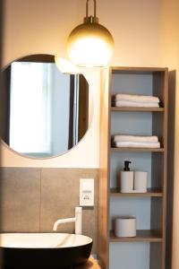 a bathroom with a sink and a mirror at VS Apartments - apartament nr 33 in Łódź