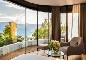 a hotel room with a view of the ocean at Yacht Hotel in Vlorë