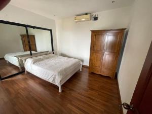Postel nebo postele na pokoji v ubytování Baan Chaweng Hill Samui
