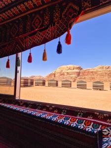 a view of the desert from the inside of a tent at Star City Camp wadirum in Wadi Rum