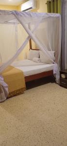מיטה או מיטות בחדר ב-Bella Breeze1 - Diani Beach, Kenya