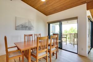a dining room with a wooden table and chairs at Stunning Solana Beach Condo with Community Pools! in Solana Beach