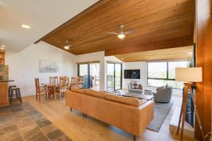 a living room with a couch and a table at Stunning Solana Beach Condo with Community Pools! in Solana Beach