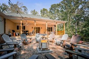 a backyard with chairs and a fire pit at Season 4 Escape - Managed by Gr8Escapes in Massanutten