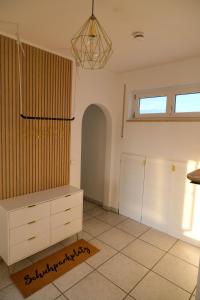 a room with a dresser and two closets at Vesteblick-Penthouse in Coburg