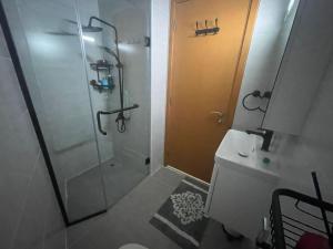 a bathroom with a shower and a toilet and a sink at 2-bedroom & 3 bath in Dubai Marina & 5 min walking to JBR in Dubai