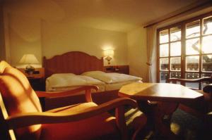 Postel nebo postele na pokoji v ubytování Hotel Gasthof Moosleitner