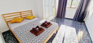 a bedroom with a bed with two pillows on it at Garajonay 3 bedrooms apartment, ocean & pool view in Playa Fañabe +29 photos