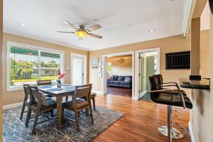 a dining room with a table and chairs at #1 Fort Lauderdale House - Heated Salt Water Pool - Private Oasis-Updated Gorgeous 3BR 3BA - Las Olas in Fort Lauderdale