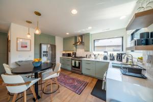 a kitchen with a table and chairs in a kitchen at Mini Marshmallow 30 Days minimum apts in Bend