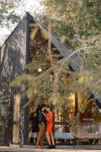 a man and a woman standing in front of a building at Gabaa Resort & Spa - Habarana in Habarana