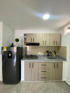 A cozinha ou cozinha compacta de Hermoso ApartaEstudio Centrico
