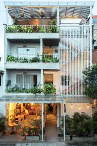 an external view of a building with plants at La Martina Hotel Boutique in Medellín