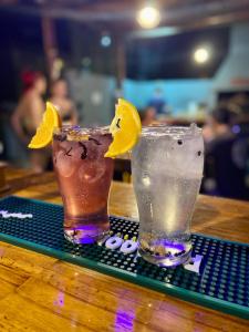 two cocktails sitting on top of a table at Hostel Alvear in Córdoba