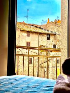 a view of a building from a window at Nazareth Residence in Viterbo