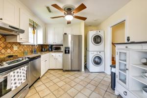 a kitchen with a refrigerator and a washer and dryer at 8 Mi to Richmond Pet-Friendly Vacation Rental! in Mechanicsville