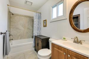 a bathroom with a sink and a toilet and a bathtub at 8 Mi to Richmond Pet-Friendly Vacation Rental! in Mechanicsville +16 photos