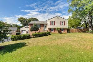a house with a large yard in front of a house at 8 Mi to Richmond Pet-Friendly Vacation Rental! in Mechanicsville