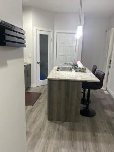 a kitchen with a sink and a counter top at Home for yourself in Winnipeg