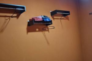 a room with a bed and two lights on a wall at casa grande e confortável in Pirapora