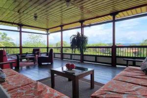 a living room with a couch and a coffee table at Finca El Descanso del Duque in La Palmilla