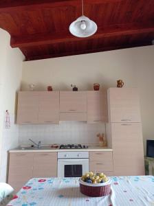 Η κουζίνα ή μικρή κουζίνα στο Dependance Villa Grazia