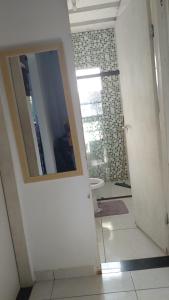 a bathroom with a mirror and a sink at Sunny Beach in Serra