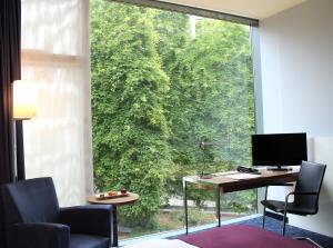 TV a/nebo společenská místnost v ubytování Seminaris CampusHotel Berlin