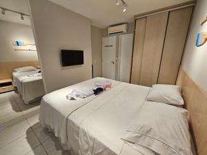 Ένα ή περισσότερα κρεβάτια σε δωμάτιο στο Flat Luxo Térreo com varanda privativa no Nannai e com Varanda Gourmet - LocarHouse