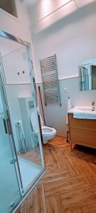 a bathroom with a shower and a toilet and a sink at Drzewna Apartamenty - Wrocławska in Zielona Góra