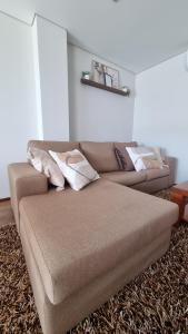 a couch in a living room with at Apartament F&M in Braga