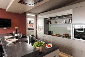 a kitchen with a counter top in a room at 105m2 Penthouse Sea View Rijeka with FREE GARAGE PARKING in Rijeka +13 photos