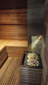 an inside of a sauna with a pile of food at Apart Hotel 48 in Mogi das Cruzes