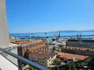 a view of a city from a balcony at 105m2 Penthouse Sea View Rijeka, free garage parking in Rijeka