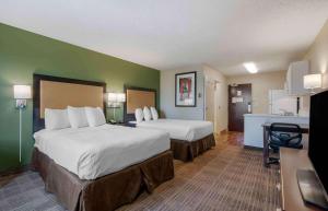 a hotel room with two beds and a kitchen at Extended Stay America Suites - Sacramento - Elk Grove in Elk Grove