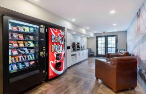 a living room with a cocacola soda machine at Extended Stay America Suites - San Ramon - Bishop Ranch - East in San Ramon